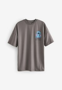 T-shirt grigia a maniche corte in tessuto morbido, con un personaggio dei cartoni animati blu e la scritta "Non faccio le mattine" sotto.