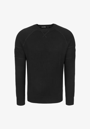Zwarte trui met lange mouwen en ronde hals, voorzien van geribbelde manchetten, zoom en subtiele stikdetails op de mouwen en borst.