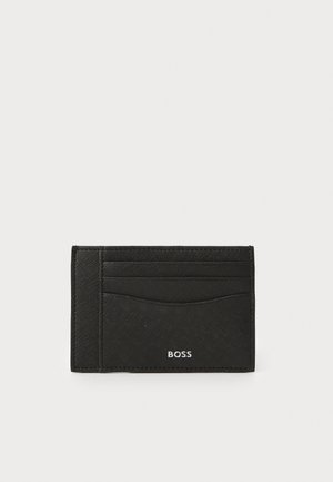 Black cardholder made of textured material, featuring multiple slots on one side and the logo "BOSS" embossed at the bottom.