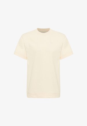 Cream-colored cotton t-shirt with short sleeves, round neckline, and a subtle logo on the chest. Smooth texture and relaxed fit.
