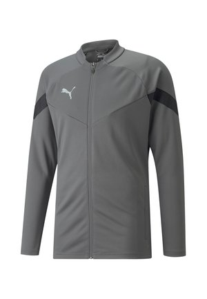 Giacca atletica grigia con colletto alto, zip completa, tessuto strutturato e pannelli neri a contrasto. Presenta un piccolo logo sul petto.