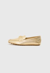 Gold leather loafers with a textured finish, featuring a decorative strap and rounded toe. Rubber outsole with small grip dots.