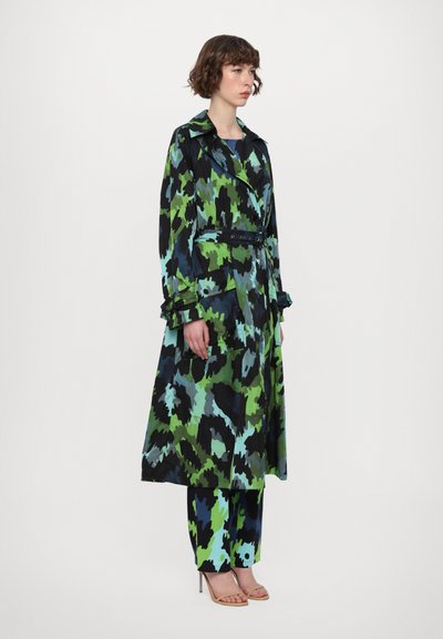 Long, belted coat in multicolored abstract pattern featuring green, blue, and black hues. Made of lightweight fabric with a smooth texture.