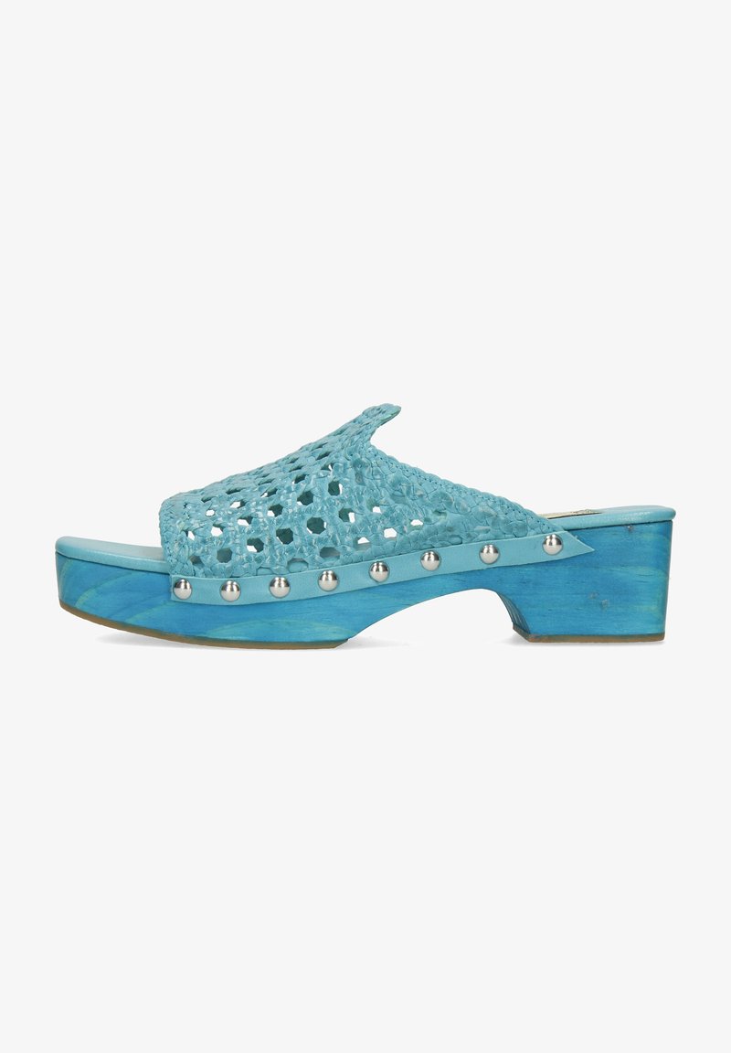 Turquoise platform clogs with a woven upper and silver studs along the side. The wooden sole has a gradient blue finish.
