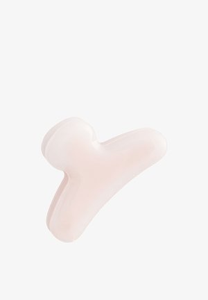 Blid lyserød trekantet hårklemme med afrundede kanter på hvid baggrund.