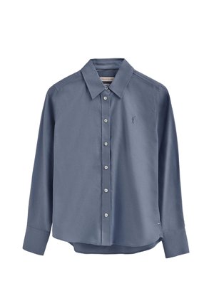 Camicia azzurro chiaro a maniche lunghe con colletto appuntito, chiusura frontale con bottoni e logo ricamato sul petto a sinistra. Tessuto dalla texture liscia.