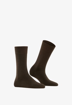 Brown cotton socks with a ribbed cuff, a smooth texture, and a mid-calf length. Simple design with no visible patterns or accents.