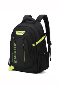 Zaino nero con accenti verdi, diversi scomparti con zip, spallacci imbottiti e un esterno in tessuto resistente.
