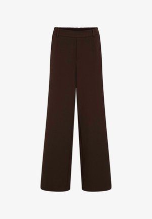 Bruine wijde broek van zacht materiaal, met een elastische tailleband en zijzakken. Het ontwerp heeft een rechte snit.