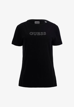 T-shirt in cotone nero con scollo rotondo e maniche corte. Presenta la parola "GUESS" in strass sul petto.