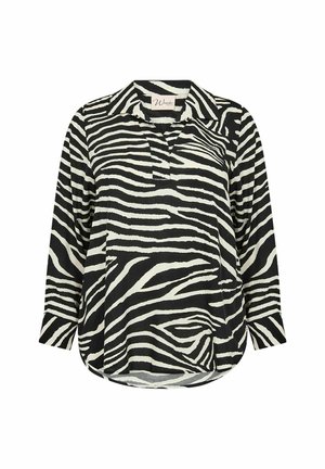 Camicia a maniche lunghe a righe zebrate in bianco e nero con colletto, chiusura con bottoni e orlo arrotondato. Tessuto morbido e leggero.