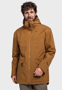Brown waterproof jacket with a high collar, front zip, adjustable cuffs, and dual zippered pockets. Smooth, matte texture.