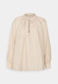 Blouse beige clair avec des rayures verticales de nuances variées. Elle possède un col froncé, des manches longues et une coupe ample.