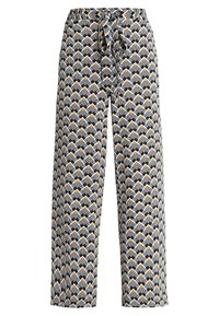 Pantalons larges en tissu à motifs présentant des formes géométriques noires, blanches et orange. Taille élastique avec un détail de lien à l'avant.