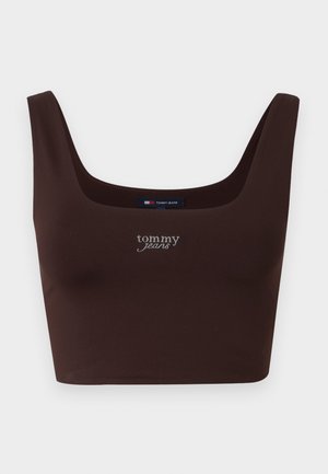 Top court brun avec un décolleté carré, logo imprimé en blanc, fabriqué en tissu extensible, présentant des bretelles épaisses.