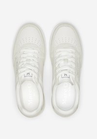White leather sneakers with perforated detailing, flat laces, and branded insoles, featuring a smooth texture and minimalistic design.