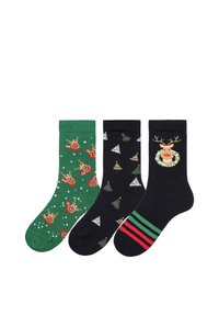Drei Paare von weihnachtlich gestalteten Socken: grün mit Rentieren, schwarz mit Weihnachtsbäumen und dunkel mit einem Rentiergesicht sowie gestreiften Akzenten.