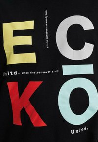 Black t-shirt featuring large, multi-colored letters spelling "ECKO" in yellow, red, and light blue, with additional text in white and gray.