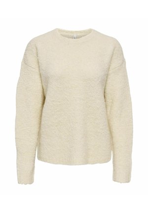 Sweter w kolorze kremowym, dziany, o strukturalnym wykończeniu, okrągłym dekolcie i opadających szwach na ramionach. Miękka tkanina z prążkowanymi wykończeniami przy mankietach.