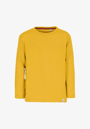 Pitkähihainen keltainen puuvillapaidan kanssa pyöreä kaula-aukko ja pieni logotagi vasemmassa alareunassa. Sileä pinta ja yksinkertainen muotoilu.