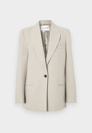 Beige maßgeschneiderter Blazer aus leichtem Stoff, mit Reverskragen, Ein-Knopf-Verschluss und zwei Fronttaschen mit dezenten Nahtdetails.