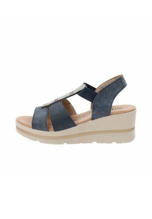 Sandalo con zeppa di colore blu navy, con tomaia testurizzata, dotato di cinturini elastici e un accento di strass. Suola della zeppa di colore chiaro, con plantare liscio.