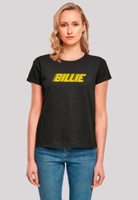 Black cotton t-shirt with short sleeves, featuring "BILLIE" in bold yellow text across the front. Straight cut and crew neckline.
