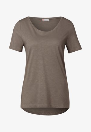 T-shirt a maniche corte e scollo rotondo in una tonalità di marrone tenue. Tessuto morbido e testurizzato con orlo leggermente curvo, caratterizzato da una lucentezza sottile.