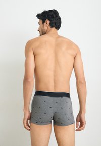 Gray cotton boxer briefs with a black waistband and small logo pattern. Fitted design, mid-thigh length, soft texture. Back view shown.