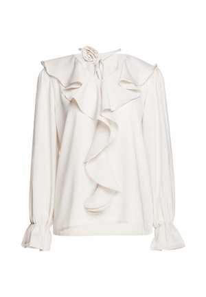Camicia bianca a maniche lunghe con balza frontale e collo, decorata con dettaglio a rosa in tessuto e polsini arricciati sulle maniche.