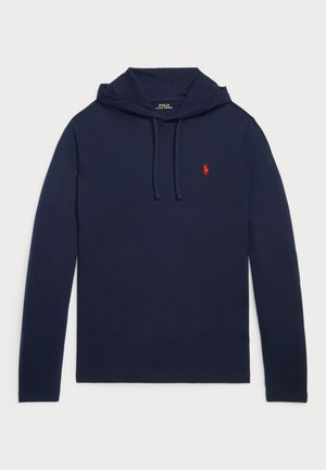 Námořnická dlouhá mikina s kapucí z bavlny, která má stahovací šňůrku, klokankovou kapsu a malé červené logo na hrudi. Hladká, jednobarevná textura.