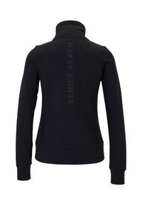 Black sweatshirt with a high collar, featuring "VENICE BEACH" printed vertically on the back. Smooth texture and fitted design.