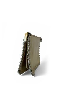 Beige wallet with a textured finish, embellished with silver bead accents along the edges, featuring a zip closure at the top.