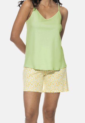 Light green sleeveless top with a V-neck, paired with yellow floral print shorts. Soft fabric with a relaxed fit, ideal for loungewear.