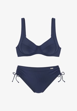 Navy blue bikini set featuring a structured underwire top and gather-style bottoms with adjustable side ties, made from smooth, stretchy fabric.