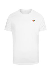 White short-sleeved t-shirt made of cotton with a small multicolored heart logo on the left chest area. Classic crew neck design.