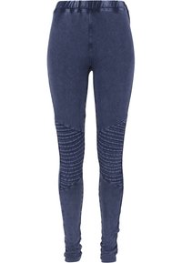 Mörkblå denimleggings med en texturerad ribbad panel längs de yttre benen och en elastisk midja för komfort.