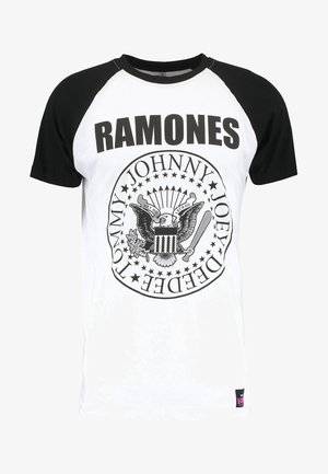 Schwarzes und weißes Kurzarm-T-Shirt mit "RAMONES"-Schriftzug und einem kreisförmigen Grafikdesign mit einem Adler und Sternen. Baumwollstoff, runder Hals.