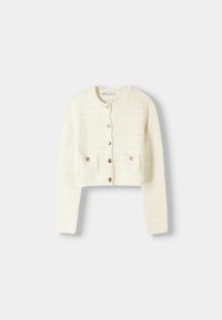 Cream-colored cropped cardigan made of textured fabric featuring a round neckline, gold button closures, and two front pockets.