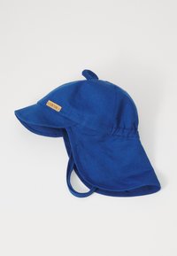 Blått stoff solhatt med bred skygge, justerbare remmer og en stoffsløyfe på toppen. Har et lite tremerke foran.
