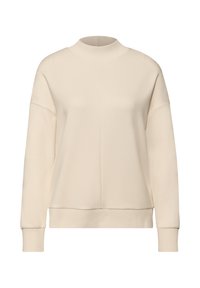 Sweat-shirt beige clair à col montant, épaules tombantes, poignets côtelés et coupe décontractée. Texture lisse.