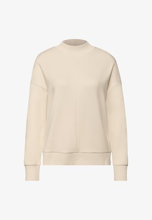 Sweat-shirt beige clair à col montant, épaules tombantes, poignets côtelés et coupe décontractée. Texture lisse.