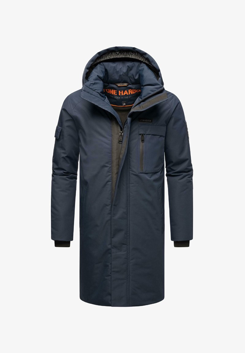 Mornarsko moder parka plašč z kapuco, z zadrgo spredaj in stranskimi žepi. Ima prešito notranjost in nastavljive manšete.