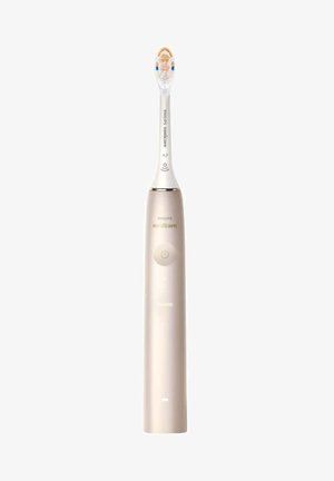 Philips Sonicare elektrische Zahnbürste, goldenem Kunststoffgriff, weißem Bürstenkopf mit blauen Akzenten, beleuchtetem Ein/Aus-Schalter und Ladeanzeige.