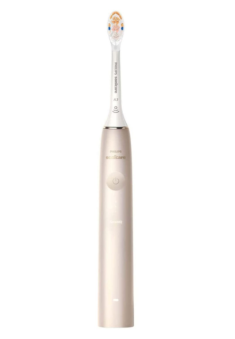 Brosse à dents électrique Philips Sonicare, manche en plastique doré, tête de brosse blanche avec accents bleus, bouton d'alimentation lumineux et indicateur de charge.