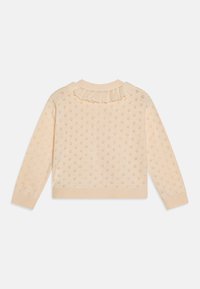 Maglione crema con colletto a volant, motivo floreale e polsini e orli a costine. Materiale in maglia leggera con finitura testurizzata.