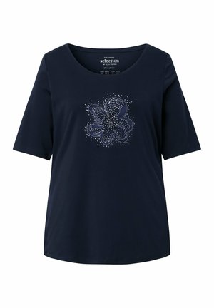 Marineblaues Kurzarmhemd mit Rundhalsausschnitt und abstraktem weißem Blumendesign mit gepunkteten Akzenten in der vorderen Mitte.