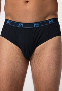 Tronchi neri in cotone con un elastico blu in vita dotato di logo. I tronchi presentano un design aderente e una texture liscia.
