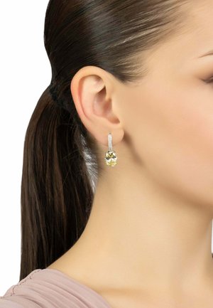Yellow gemstone drop earrings with a silver-toned leverback, featuring a sparkly, textured band and a faceted, cushion-cut design.