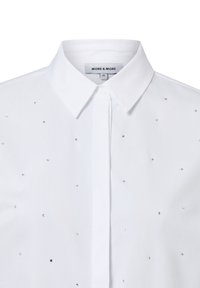 White cotton blouse with a pointed collar, featuring scattered silver rhinestones on the front. Button-up closure at the neck.